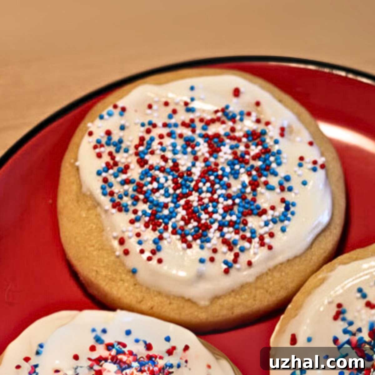 A beautifully arranged plate of classic Betty Crocker sugar cookies, showcasing their inviting texture and golden edges. The cookies are cut into various shapes, some adorned with simple frosting and sprinkles, evoking a sense of nostalgia and homemade comfort.