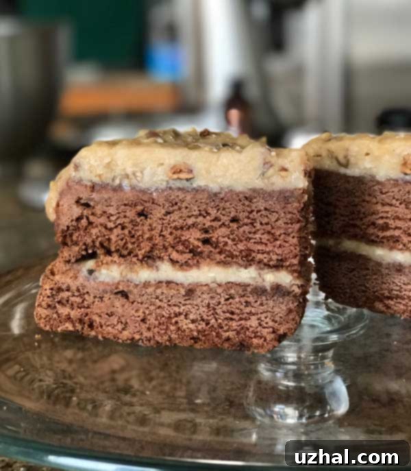 Slice of Small German Chocolate Cake, showing moist layers and rich frosting