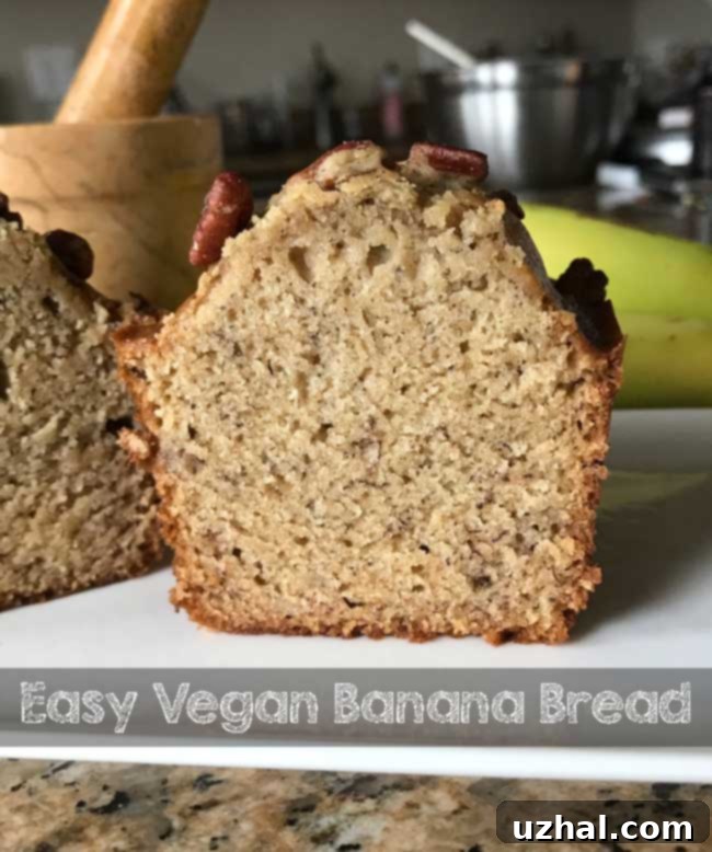 A freshly baked loaf of Easy Vegan Banana Bread, perfect for breakfast or a snack.