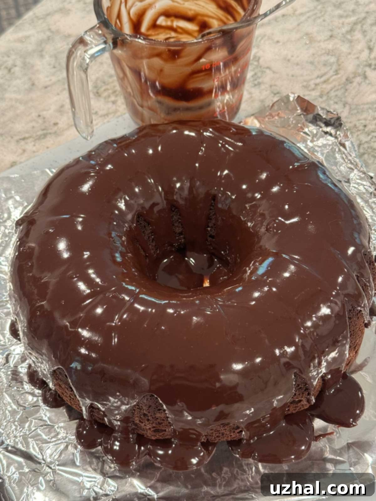 Chocolate ganache on a chocolate cheesecake Bundt cake.