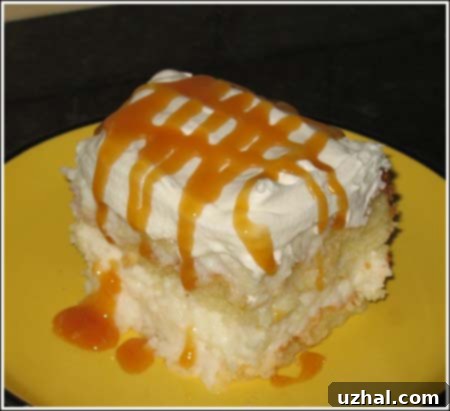 Close-up of a square Four Day Coconut Cake, showing its moist layers.