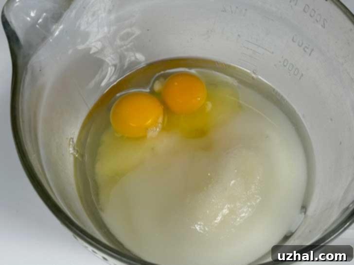 Eggs, oil and sugar in a Pampered Chef Batter Bowl