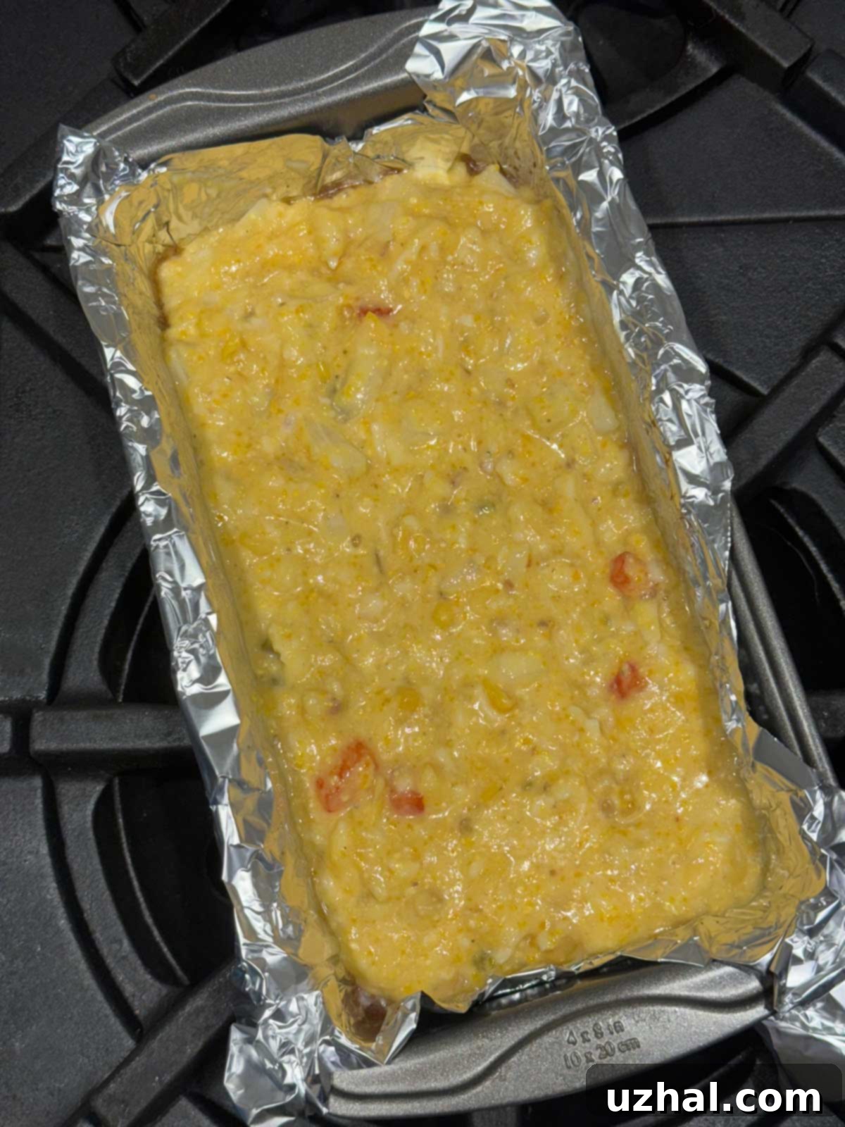 Betty Ewing's Flourless Mexican Cornbread batter baked in a loaf pan.