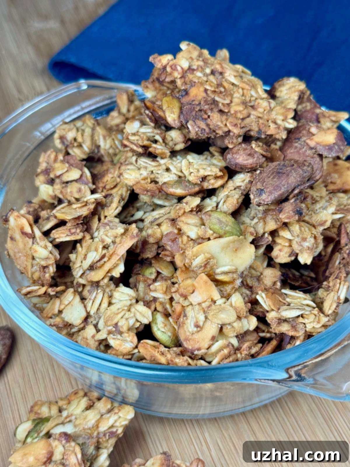 Clumpy Banana Nut Granola baking on a sheet pan, showcasing its golden-brown clusters