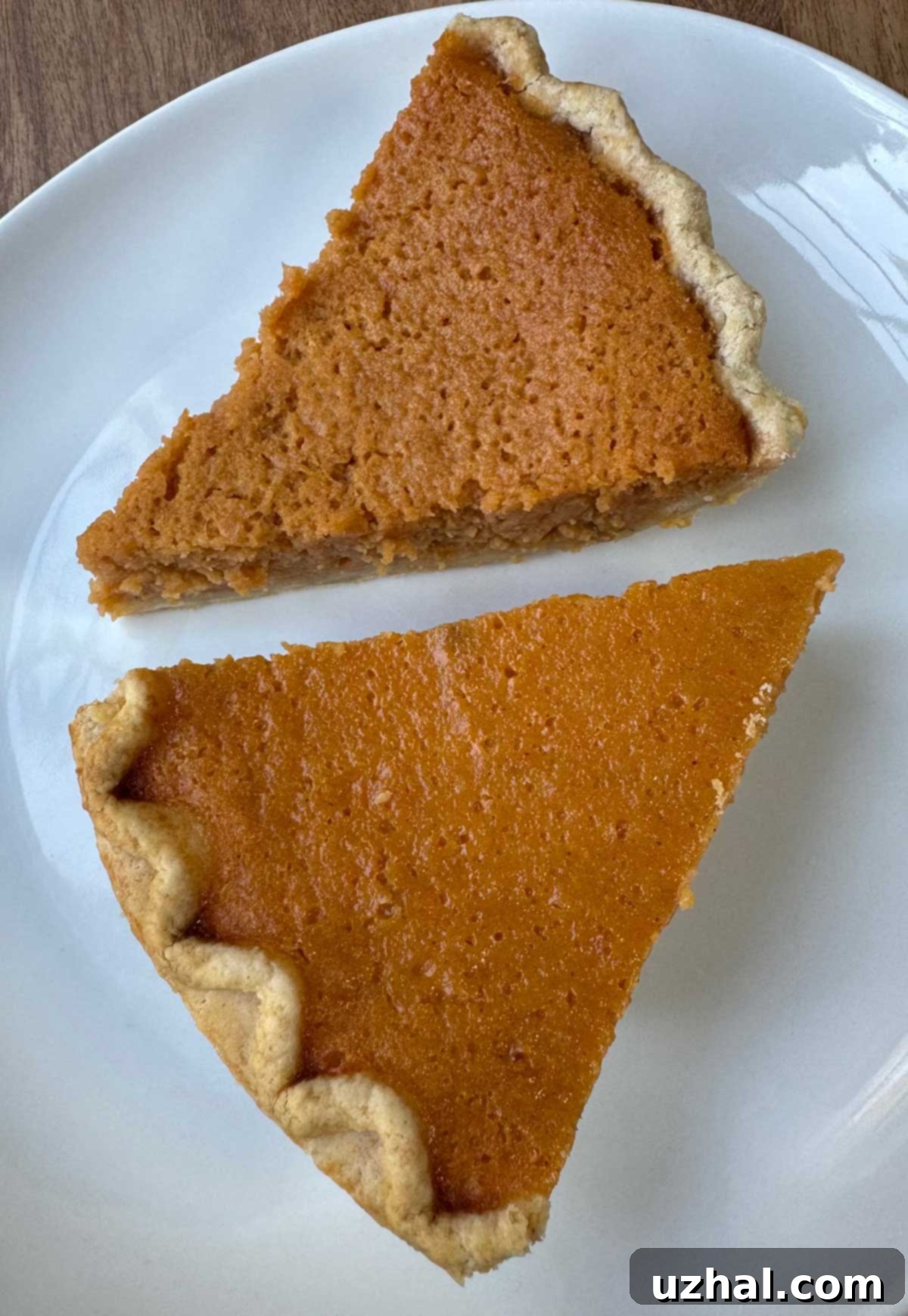 Two slices of different types of sweet potato pie, Mama Dip's vs. Ruth Reichl, arranged for a comparative tasting.