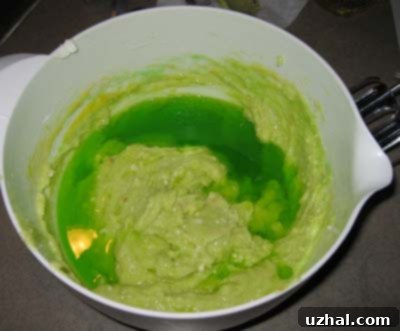 Midori Melon Bundt 2 Bottle of Midori melon liqueur and a slice of Midori Bundt cake.