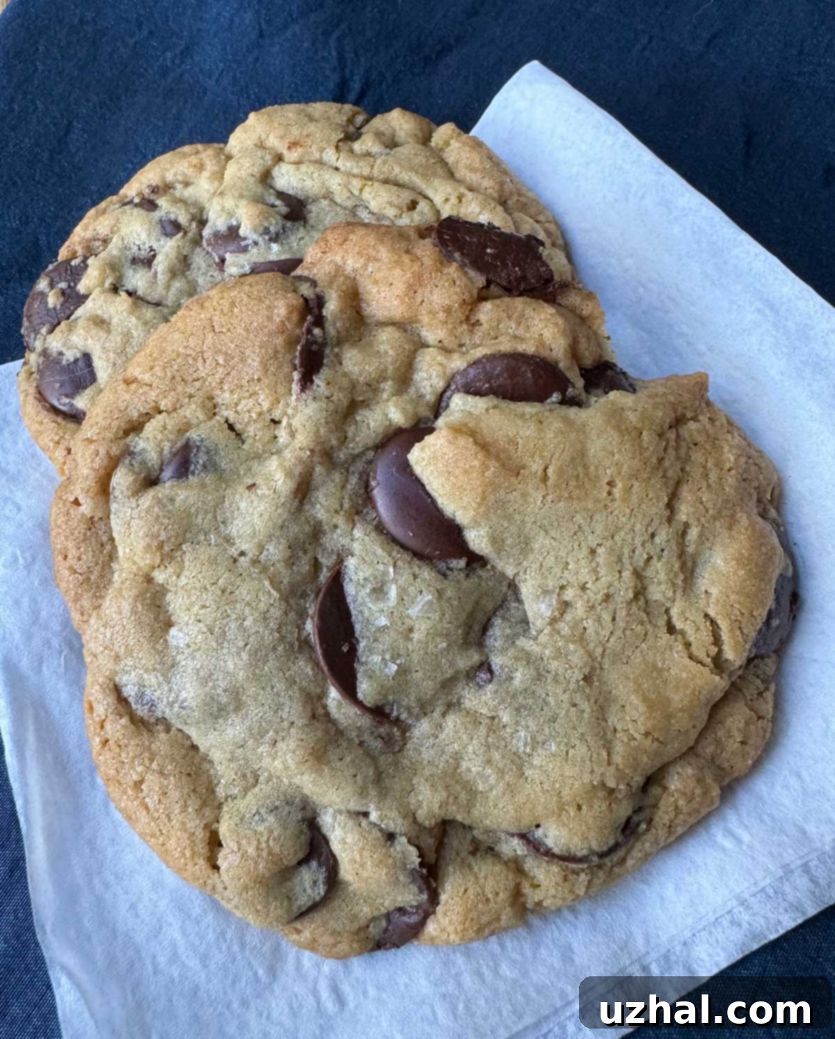 Close-up of a freshly baked Jacques Torres secret chocolate chip cookie copycat, showing rich chocolate layers and a golden-brown crust.