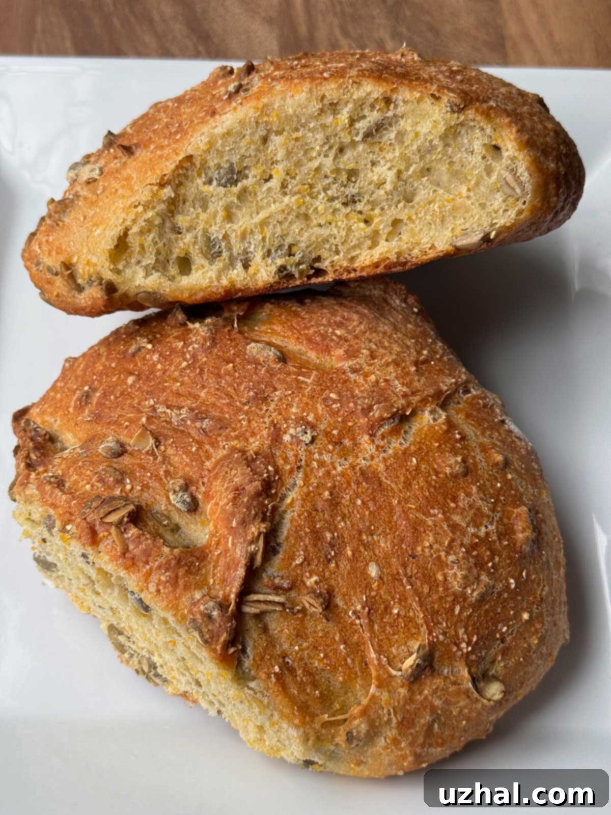 Pumpkin Seed Bread sliced to show texture and seeds.