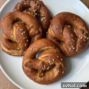 Honey Rye Pretzels on a plate, garnished with pretzel salt.