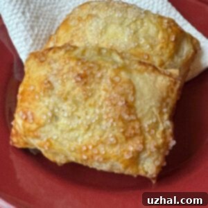 Golden Sweet Apple Pockets 6 Apple Hand Pies made with puff pastry and tapioca starch instead of cornstarch, perfectly golden brown.