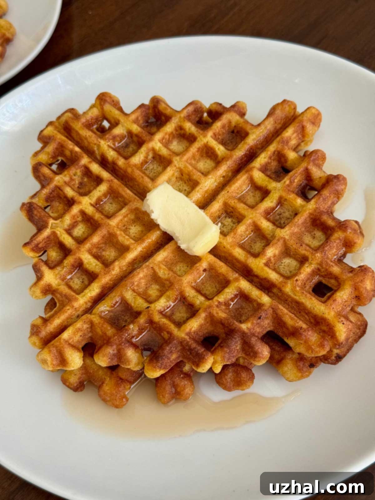 Golden pumpkin waffles with a light, crisp texture, ready to be served.