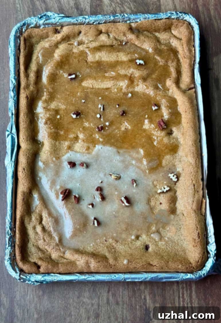 Brown Butter Maple Pecan Blondie Bars 5 Brown Butter Maple Pecan Cookie Bars in a 9x13 inch sheet pan, topped with two different maple icings for comparison.