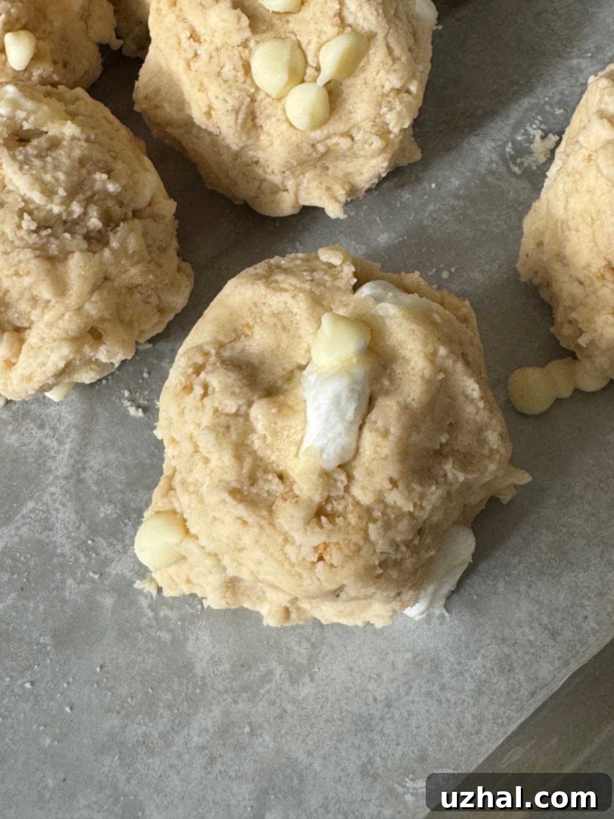 Balls of cookie dough for marshmallow treats Costco inspired cookies.