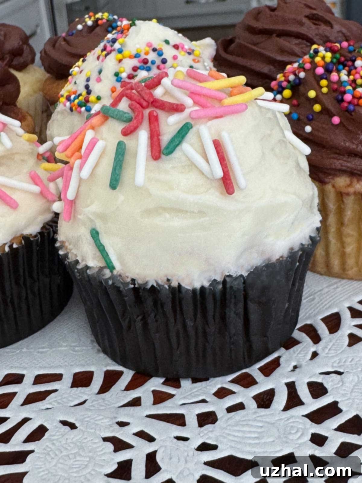 Enhanced Cake Mix Cupcakes with American Buttercream Frosting - close up of moist, delicious cupcakes